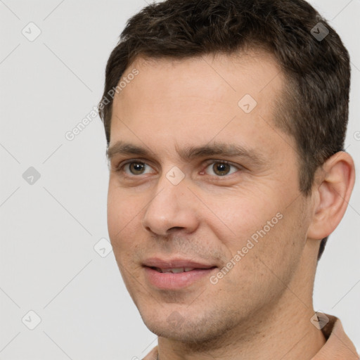 Joyful white young-adult male with short  brown hair and brown eyes