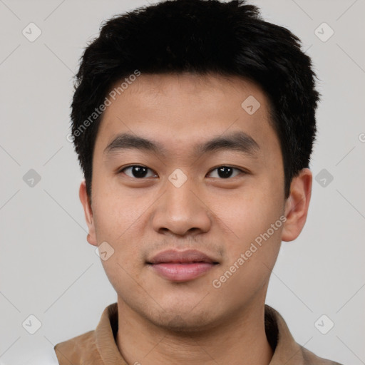 Joyful asian young-adult male with short  black hair and brown eyes