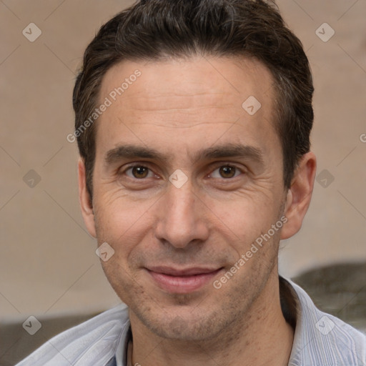 Joyful white adult male with short  brown hair and brown eyes