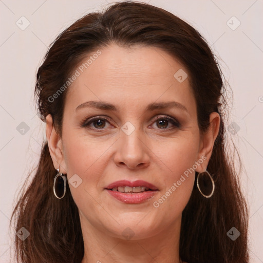 Joyful white adult female with long  brown hair and brown eyes