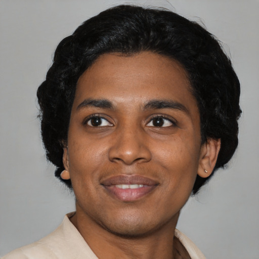 Joyful latino young-adult male with medium  black hair and brown eyes