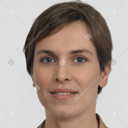 Joyful white young-adult female with short  brown hair and grey eyes