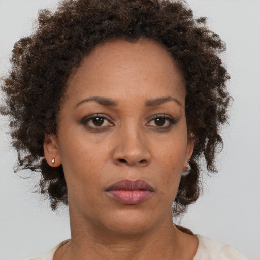 Neutral black adult female with short  brown hair and brown eyes