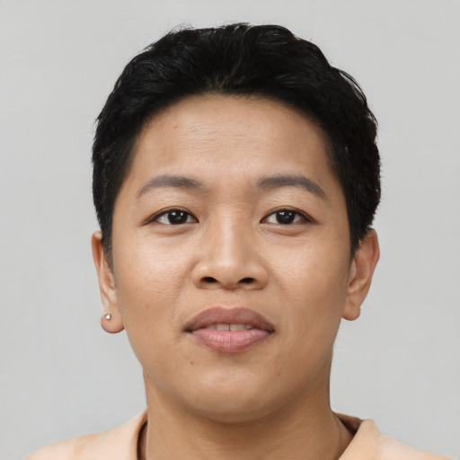 Joyful asian young-adult female with short  black hair and brown eyes