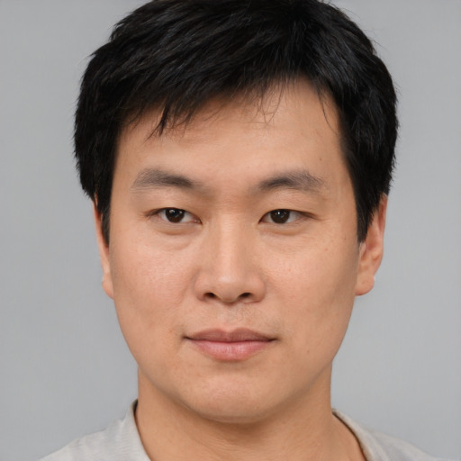 Neutral asian young-adult male with short  brown hair and brown eyes