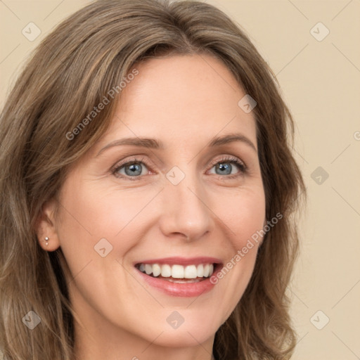 Joyful white young-adult female with long  brown hair and green eyes