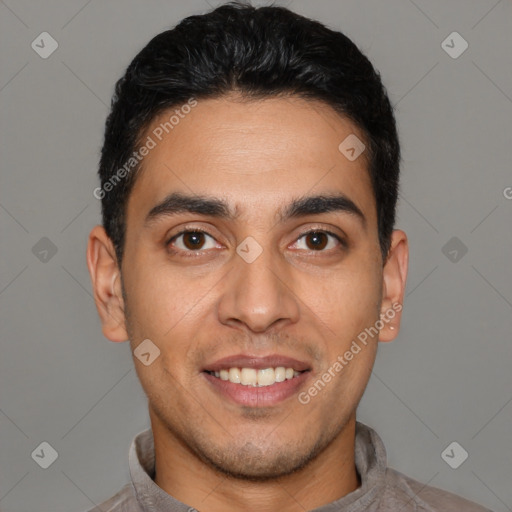 Joyful white young-adult male with short  black hair and brown eyes