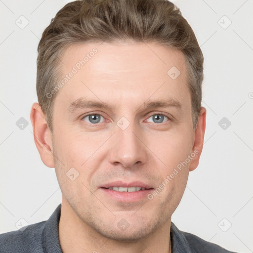 Joyful white adult male with short  brown hair and grey eyes