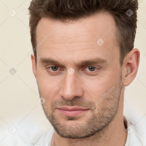 Neutral white adult male with short  brown hair and brown eyes