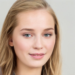 Joyful white young-adult female with long  brown hair and blue eyes