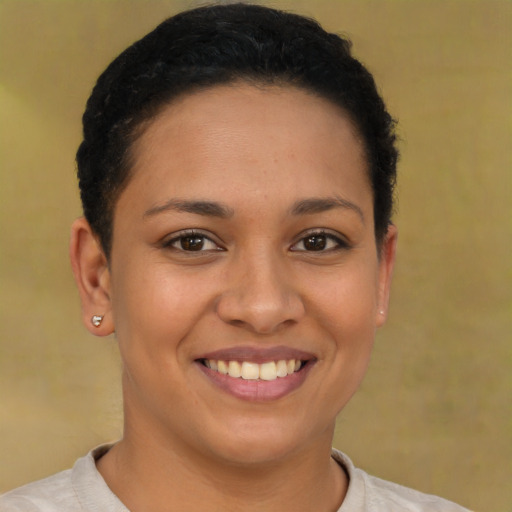 Joyful latino young-adult female with short  brown hair and brown eyes