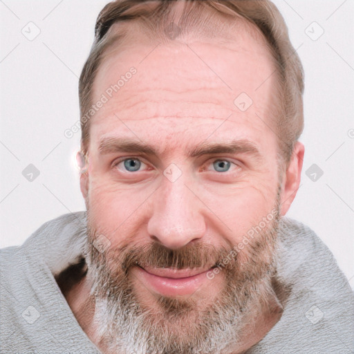 Joyful white adult male with short  brown hair and blue eyes