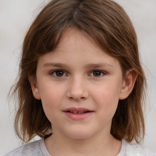 Joyful white child female with medium  brown hair and brown eyes