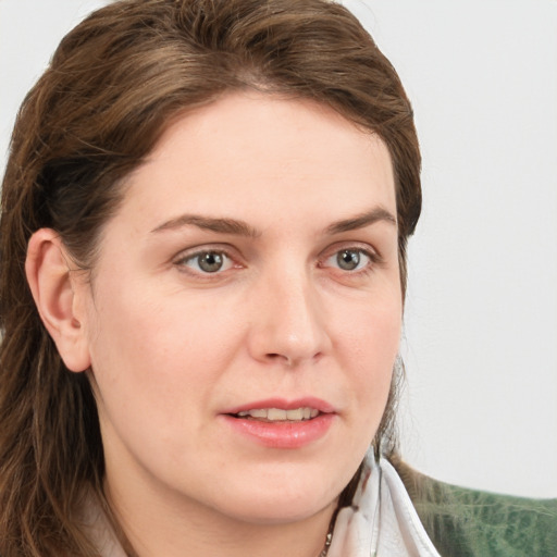 Joyful white young-adult female with medium  brown hair and blue eyes