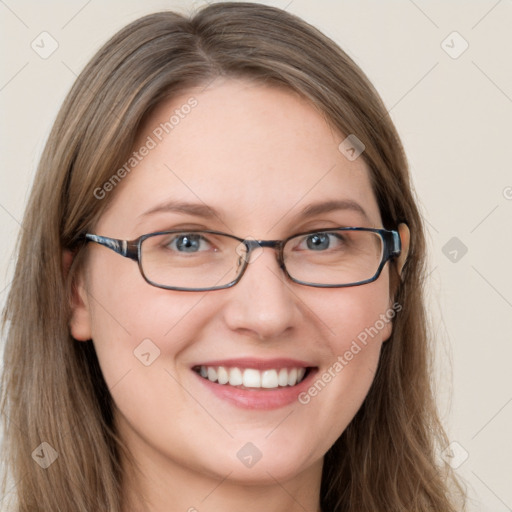 Joyful white young-adult female with long  brown hair and blue eyes