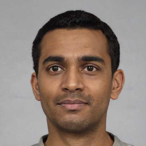 Neutral black young-adult male with short  black hair and brown eyes