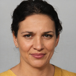 Joyful white adult female with short  brown hair and brown eyes