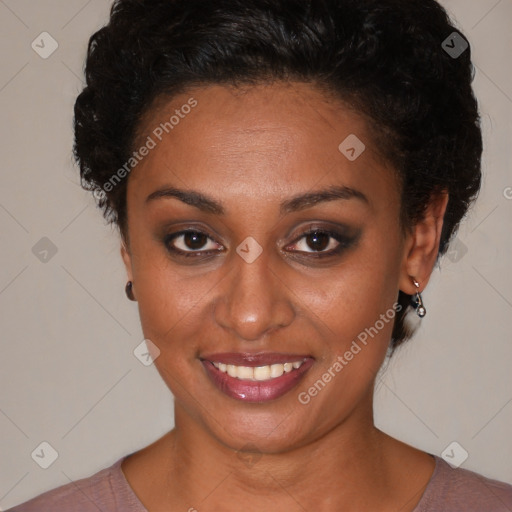 Joyful black young-adult female with short  brown hair and brown eyes