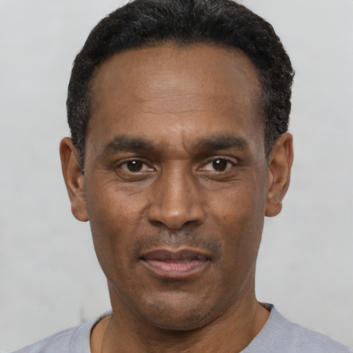 Neutral black adult male with short  black hair and brown eyes