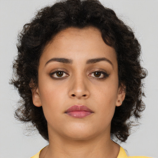 Neutral latino young-adult female with long  brown hair and brown eyes