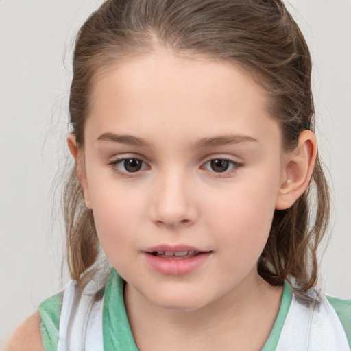 Joyful white child female with medium  brown hair and brown eyes