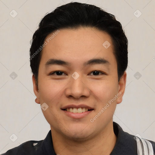 Joyful latino young-adult male with short  black hair and brown eyes