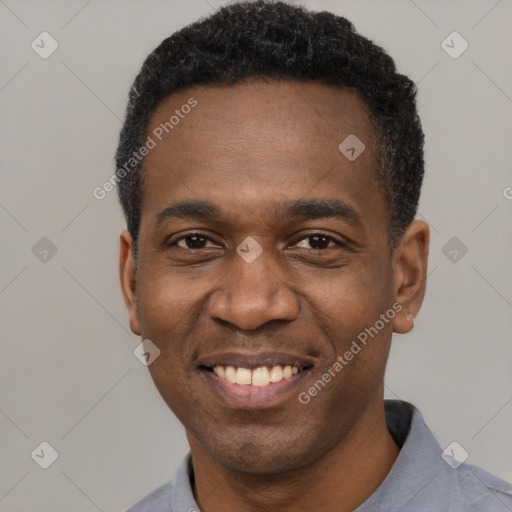 Joyful latino adult male with short  black hair and brown eyes