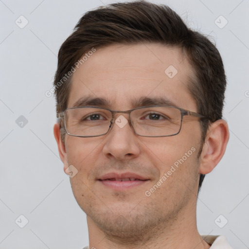 Joyful white adult male with short  brown hair and brown eyes