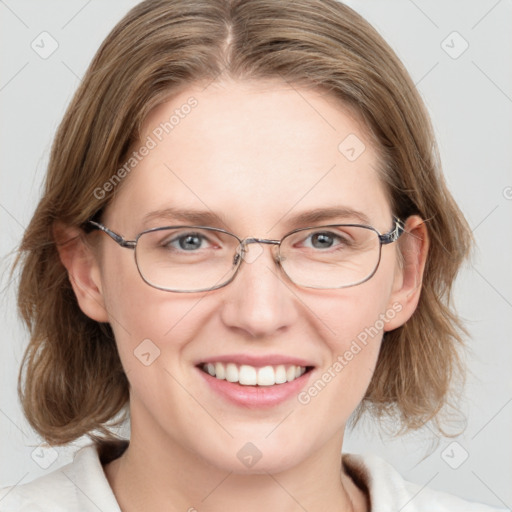 Joyful white adult female with medium  brown hair and blue eyes