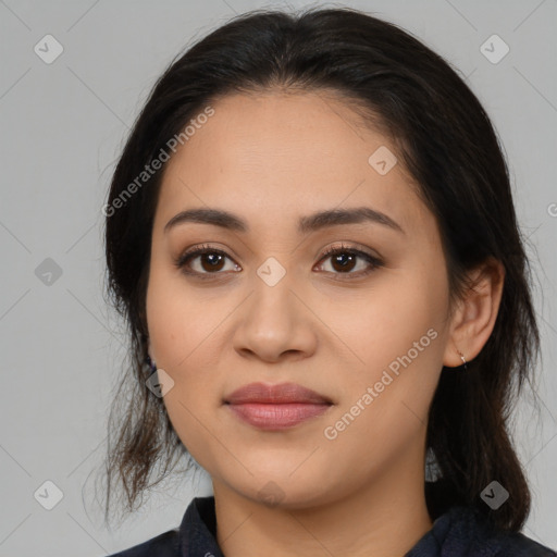 Joyful latino young-adult female with medium  brown hair and brown eyes