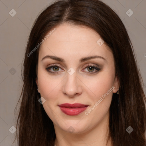 Joyful white young-adult female with long  brown hair and brown eyes