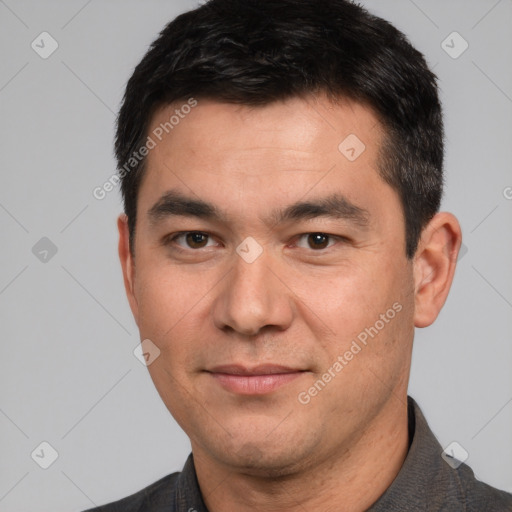 Joyful white young-adult male with short  black hair and brown eyes