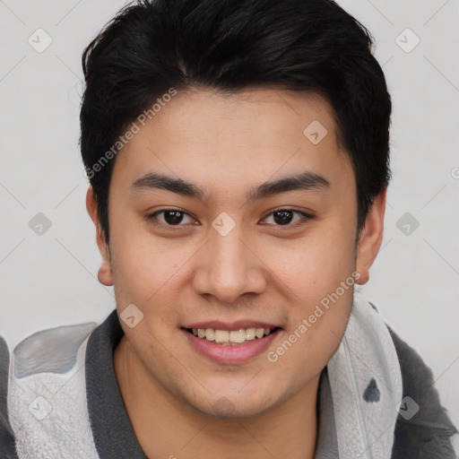 Joyful asian young-adult male with short  brown hair and brown eyes