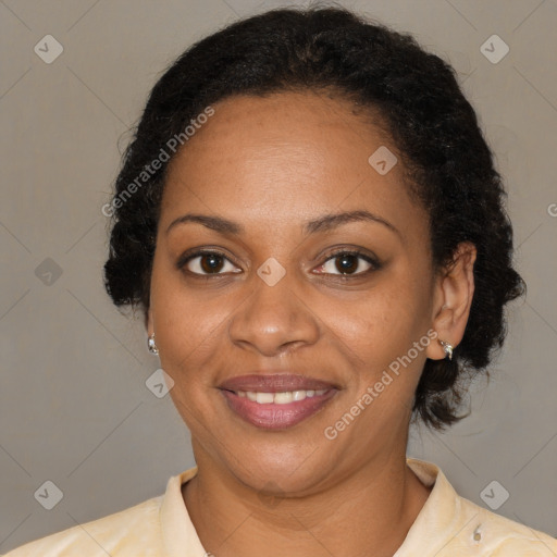 Joyful black adult female with medium  brown hair and brown eyes