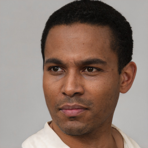 Neutral latino young-adult male with short  black hair and brown eyes