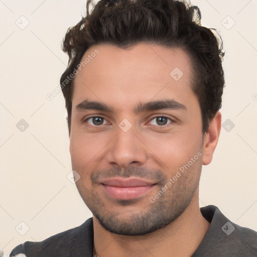 Joyful white young-adult male with short  black hair and brown eyes