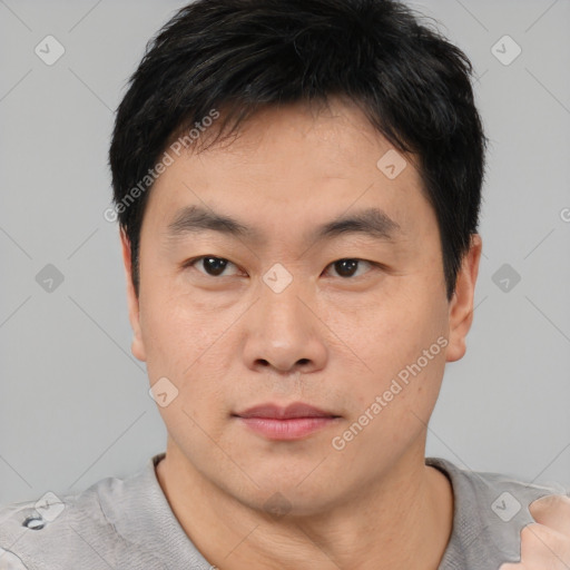 Neutral asian young-adult male with short  black hair and brown eyes