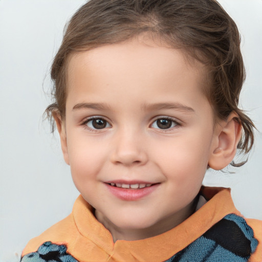 Joyful white child female with short  brown hair and brown eyes