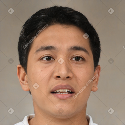 Joyful asian adult male with short  black hair and brown eyes