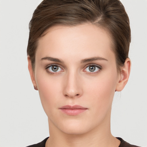 Neutral white young-adult female with short  brown hair and brown eyes