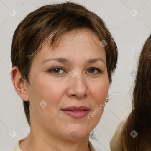 Joyful white adult female with short  brown hair and brown eyes