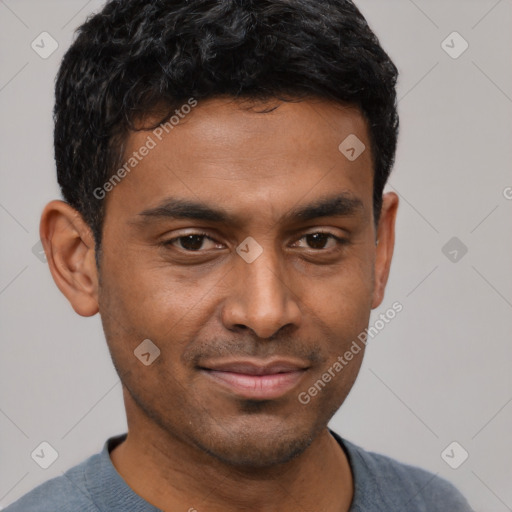 Joyful black young-adult male with short  brown hair and brown eyes