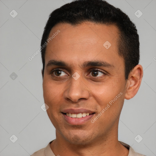 Joyful latino young-adult male with short  brown hair and brown eyes