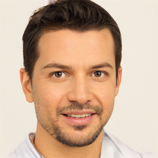 Joyful white young-adult male with short  brown hair and brown eyes