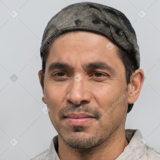 Joyful white adult male with short  black hair and brown eyes