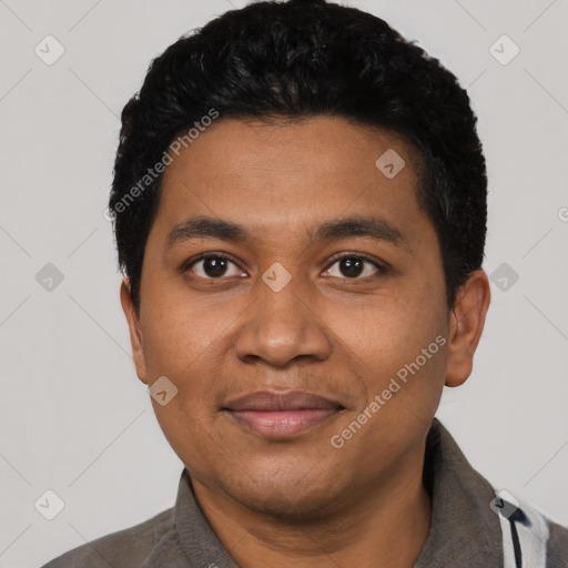 Joyful latino young-adult male with short  black hair and brown eyes