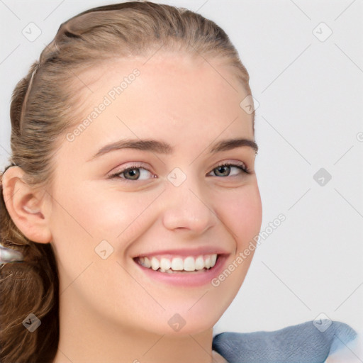 Joyful white young-adult female with long  brown hair and blue eyes