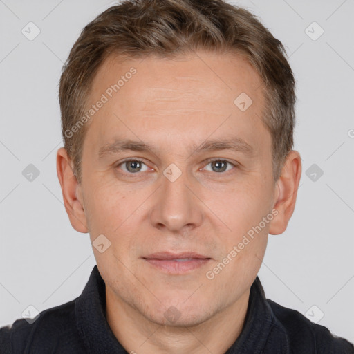 Joyful white adult male with short  brown hair and brown eyes