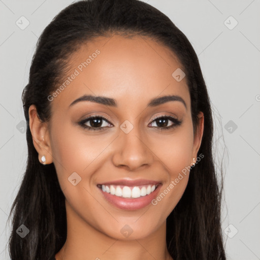 Joyful latino young-adult female with long  brown hair and brown eyes