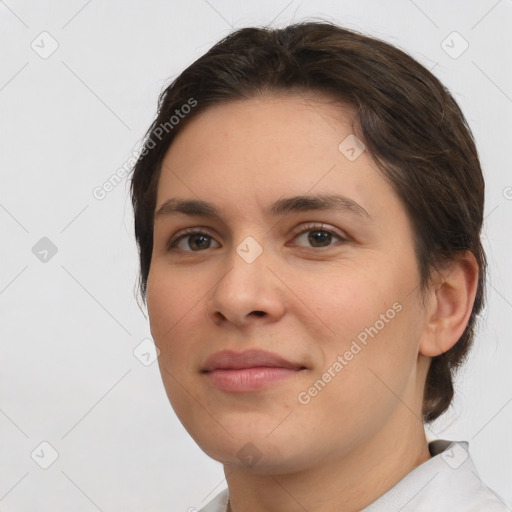 Joyful white young-adult female with short  brown hair and brown eyes